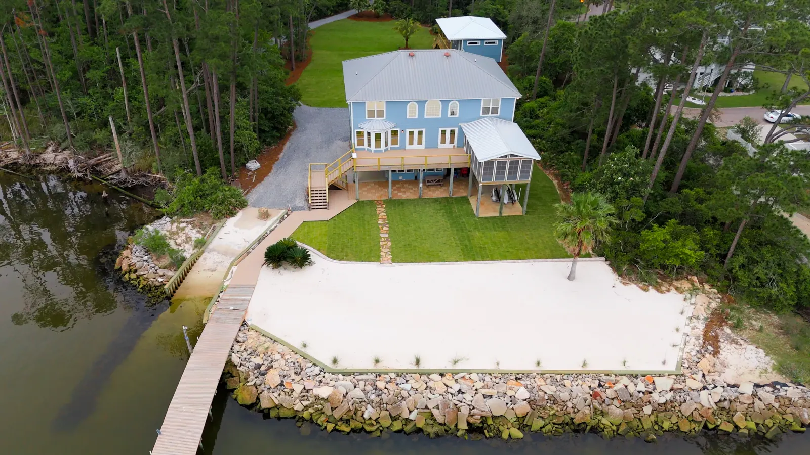 Finished lawn, planting beds and stepping-stone path at a bay-front home in Gulf Shores, Alabama