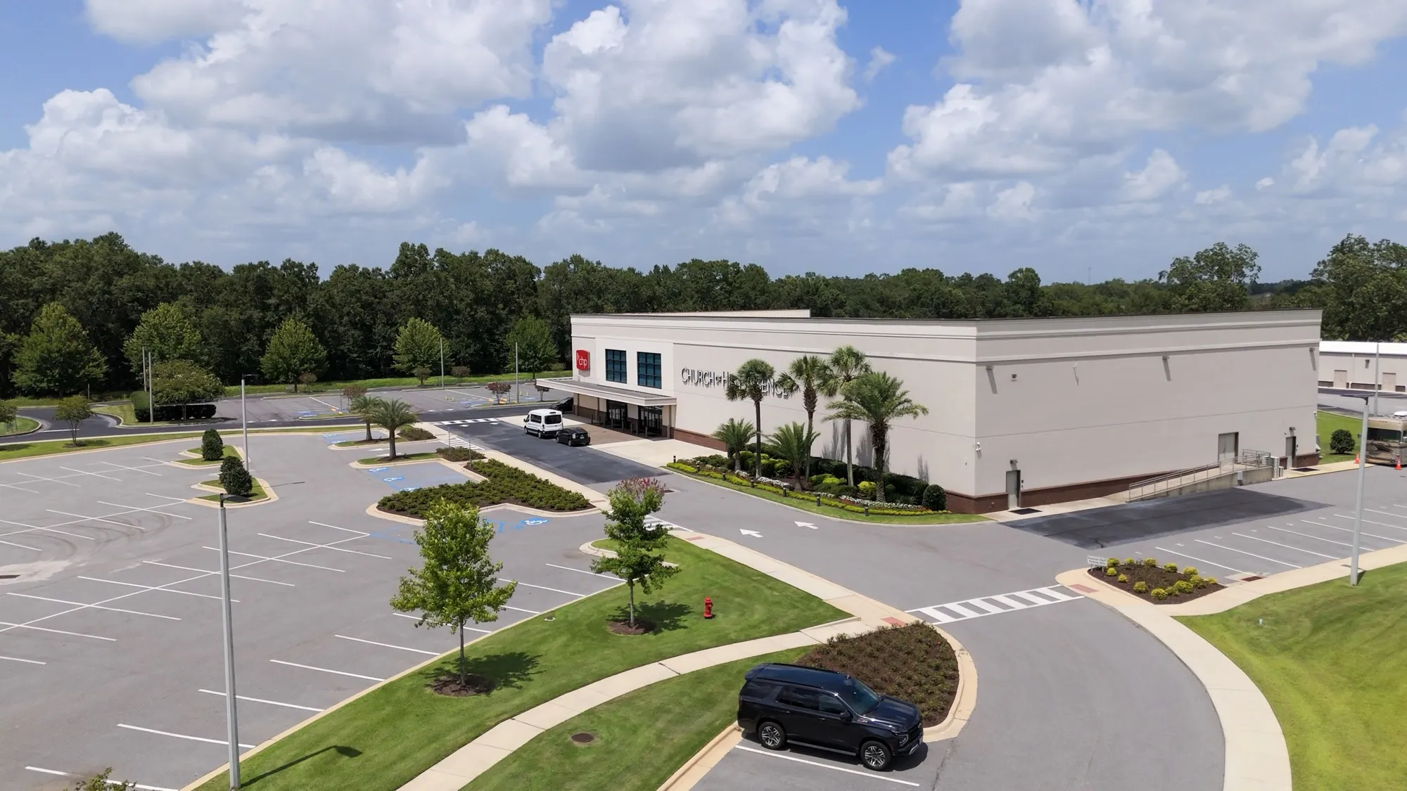 Aerial view of a church campus building and grounds in Loxley, Alabama