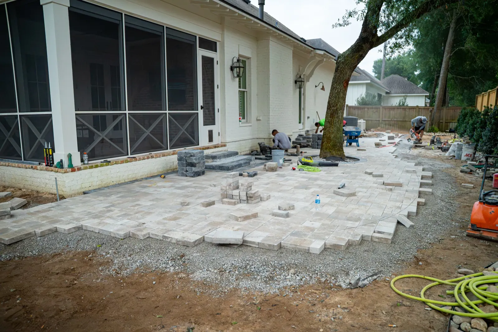 Pavers being laid over a compacted base during installation in Point Clear, Alabama